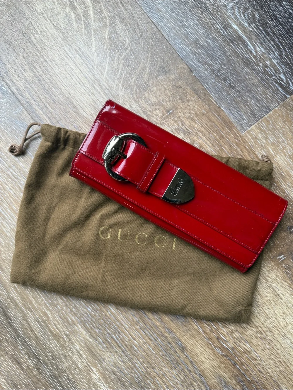 Gucci Red Patent Leather Wallet-Style Phone Case with Buckle Accent